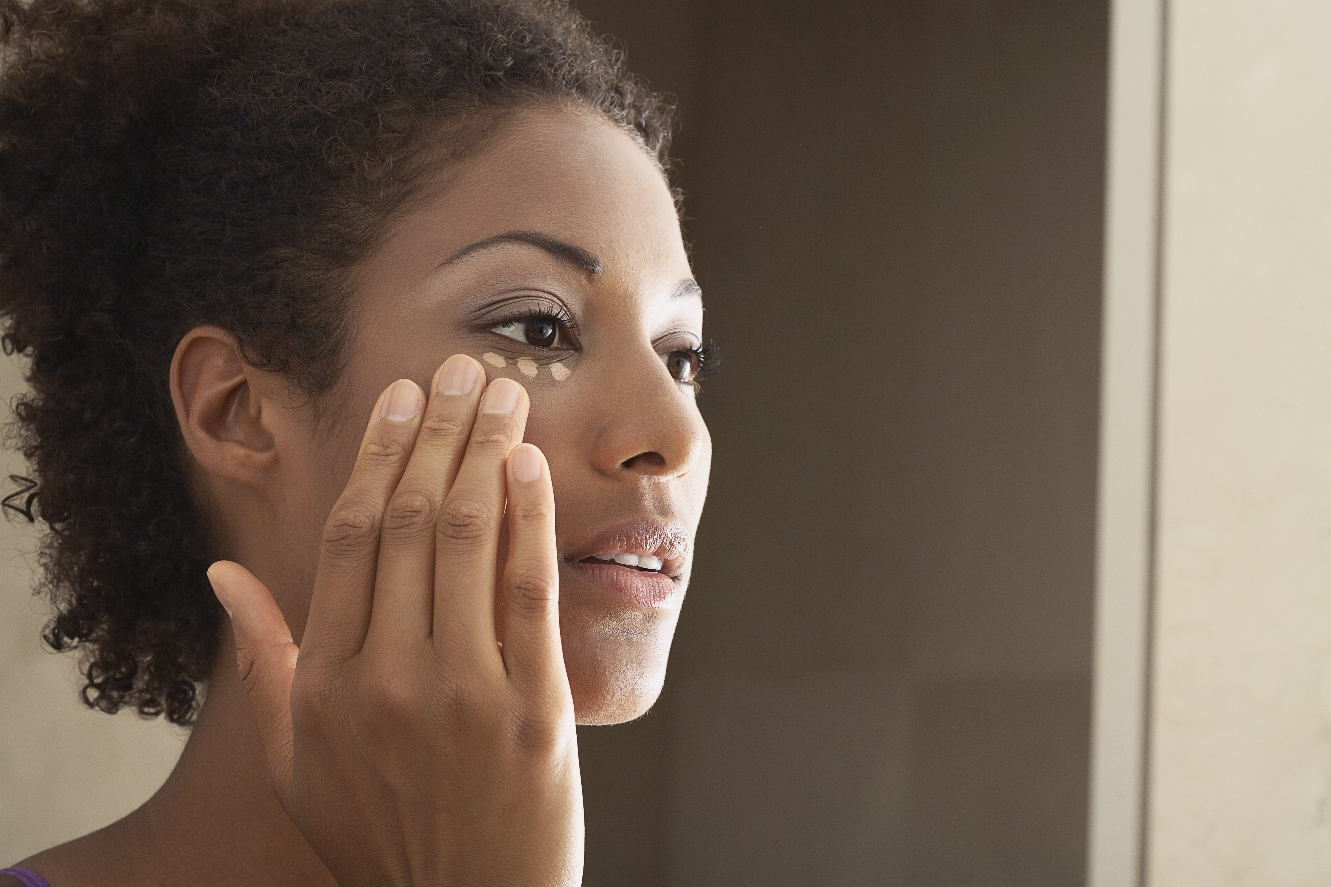 Black Woman Applying Makeup