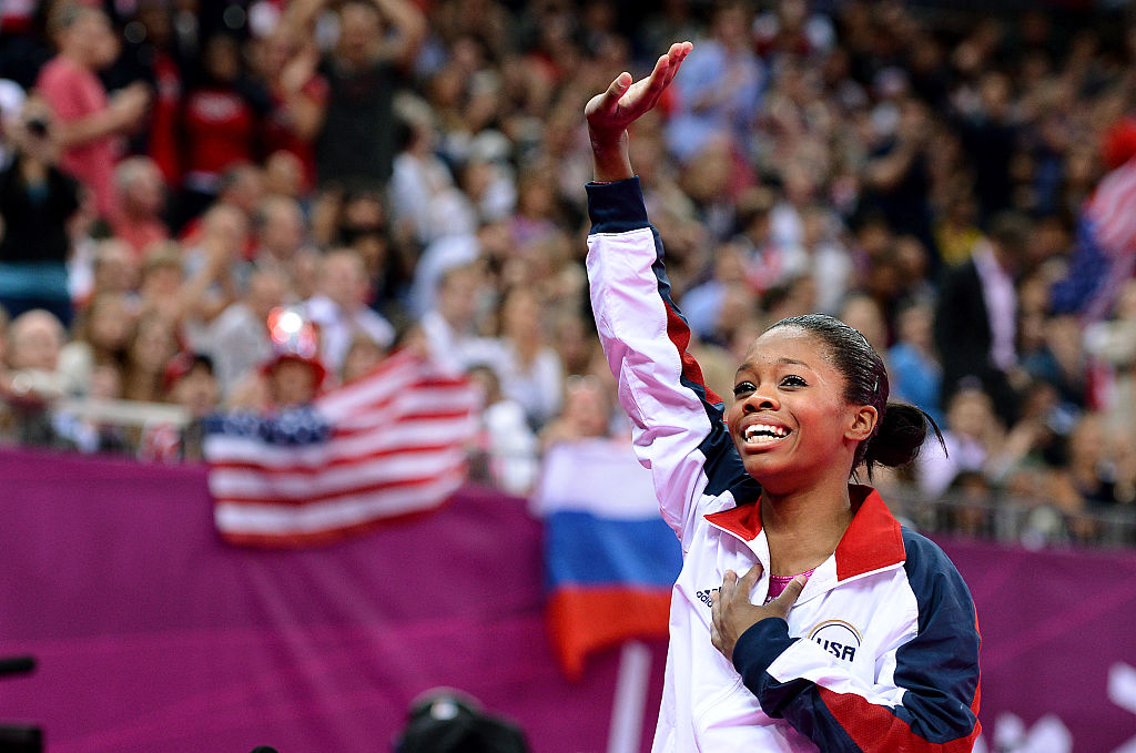 LONDON, ENGLAND AUGUST 2, 2012-USA's Gabrielle Douglas waves to the crowd after winning the gold me