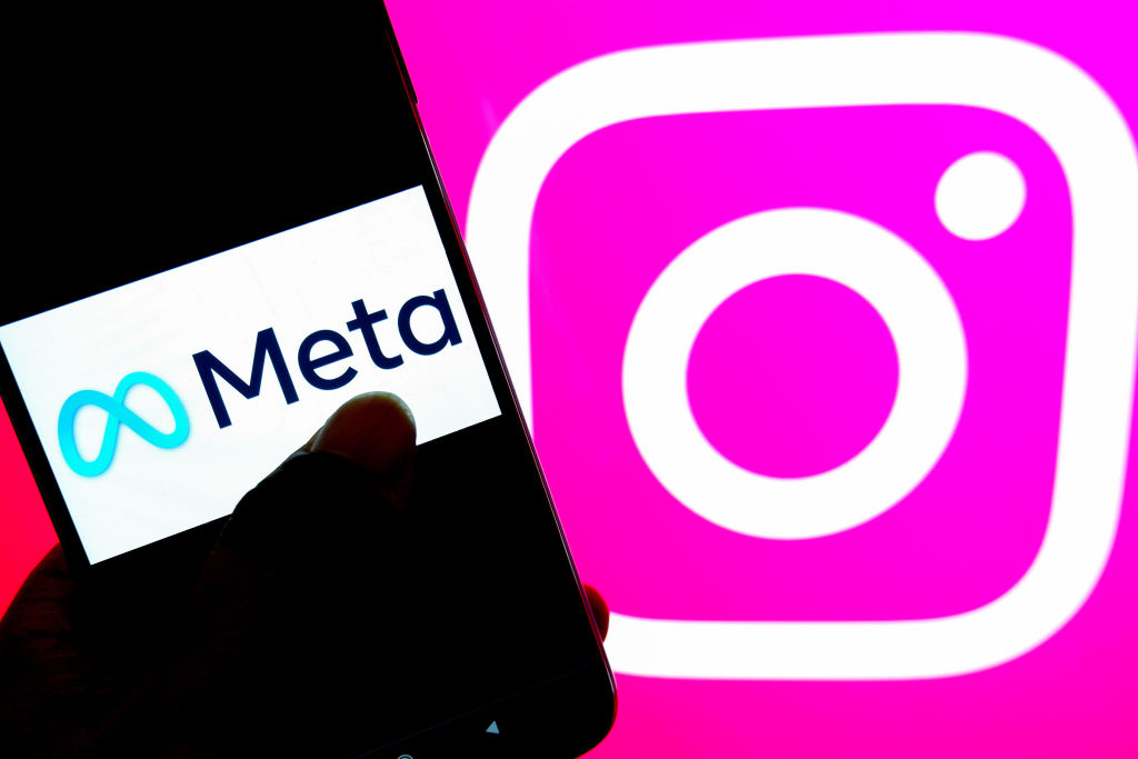 In this photo illustration, a Meta logo is seen displayed on...
