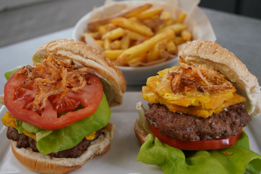 Malta Marinated Beef Burger topped with Fried Plantains