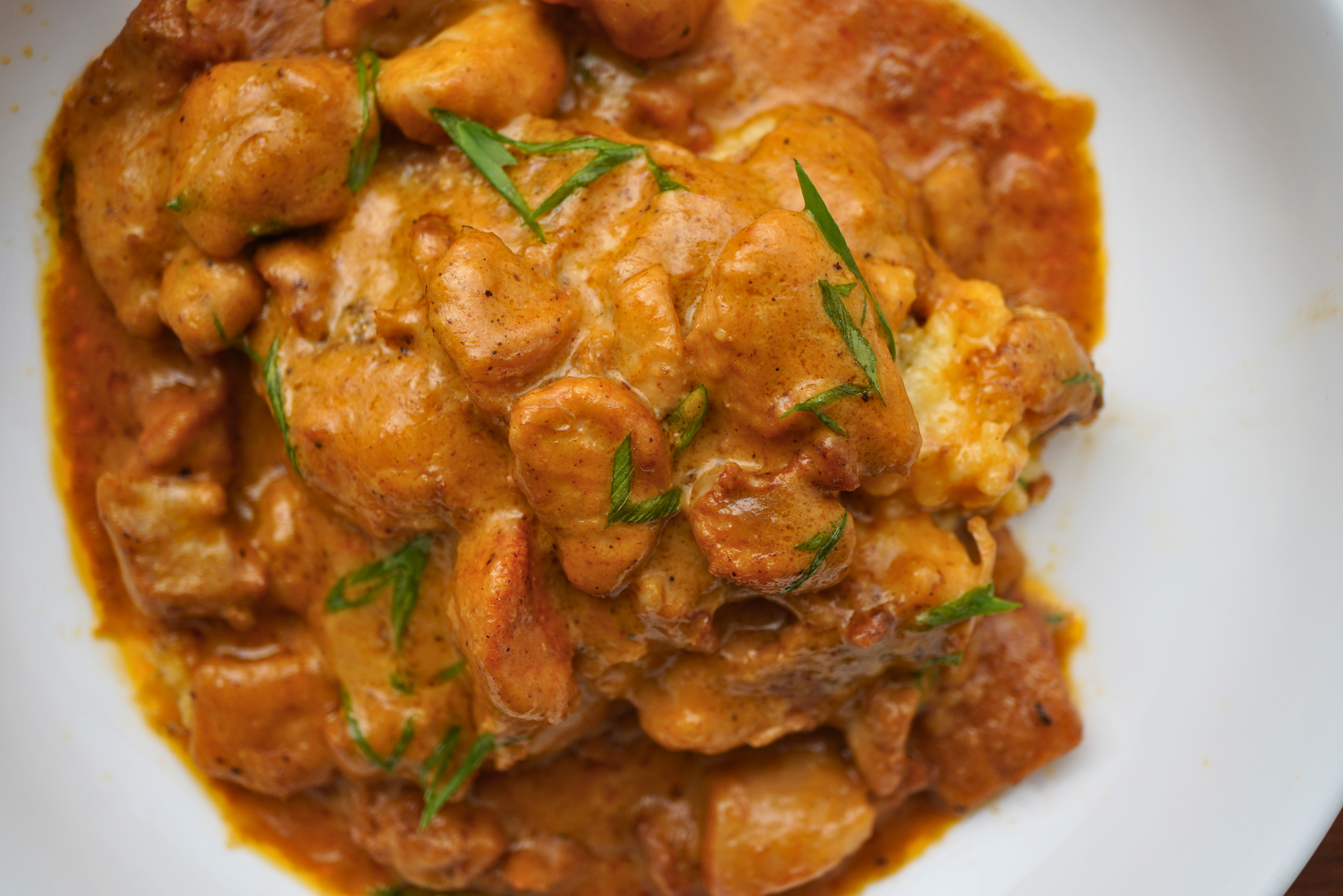 Crispy Grit Cakes with Chicken Thighs in Gravy | Just Eats