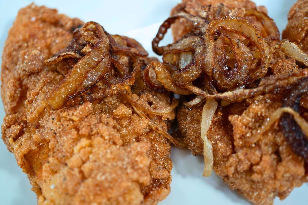 Crispy fried chicken pieces with a golden-brown, crunchy coating.